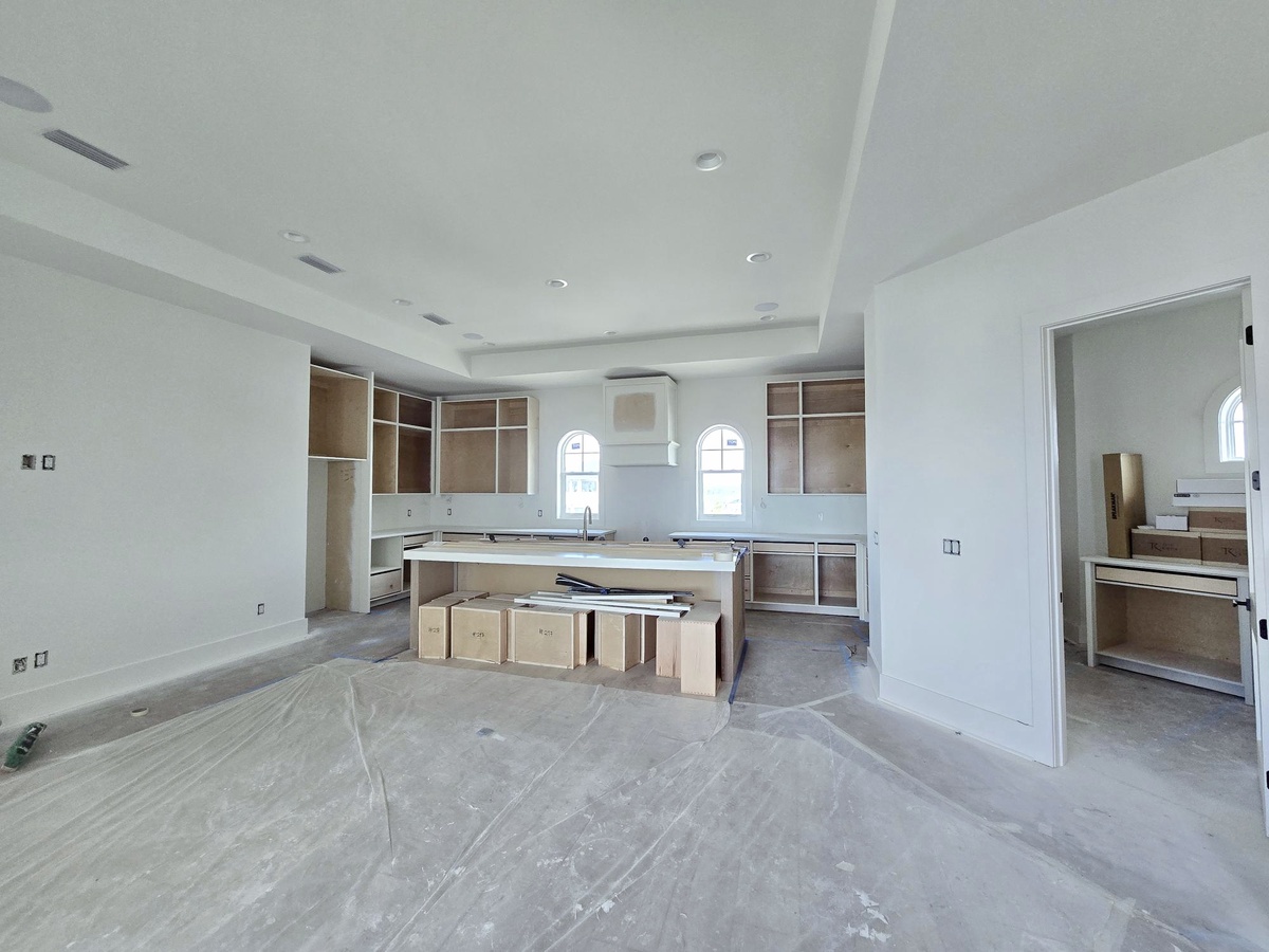 Your spacious open-plan kitchen offers endless possibilities for culinary adventures, with sleek modern design and abundant counter space for memorable meals.