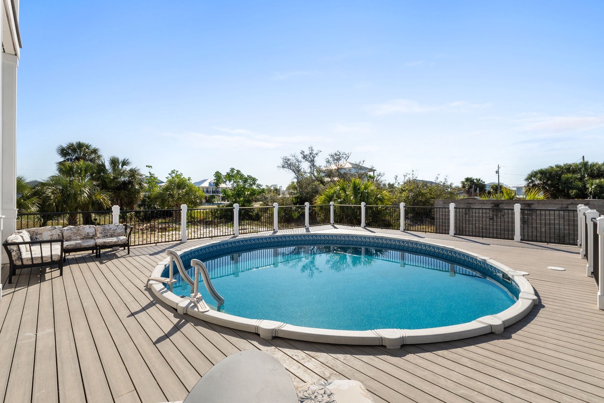 Take a refreshing dip in your private round pool surrounded by tropical views and peaceful neighborhood scenery.