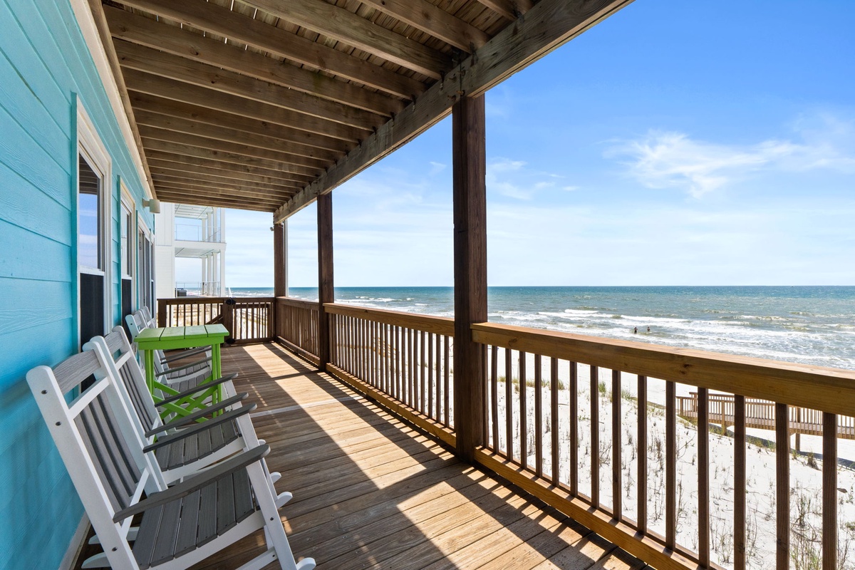Picture yourself here: waves rolling in steps away, warm sun filtering through the pergola, and comfortable chairs waiting for your morning coffee or sunset watch—pure beachfront bliss.