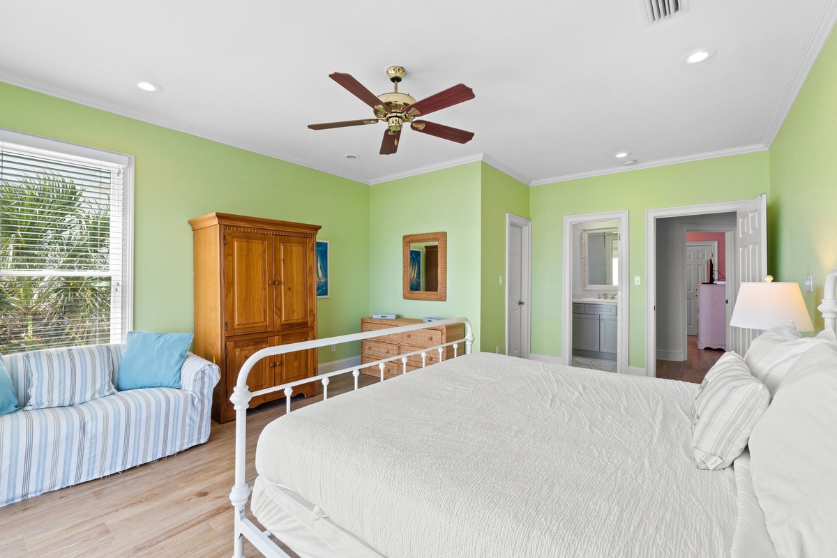 Unwind in your cheerful lime green bedroom with comfy seating nook and ensuite bathroom access for ultimate convenience.