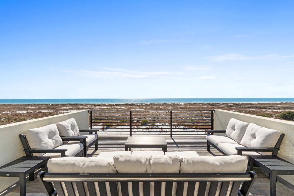 Your private terrace offers stunning ocean views with plush seating where you can relax and watch waves roll onto the shore.