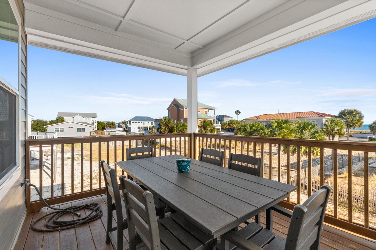 Your private covered balcony offers the perfect spot for morning coffee or evening meals, with charming neighborhood views.
