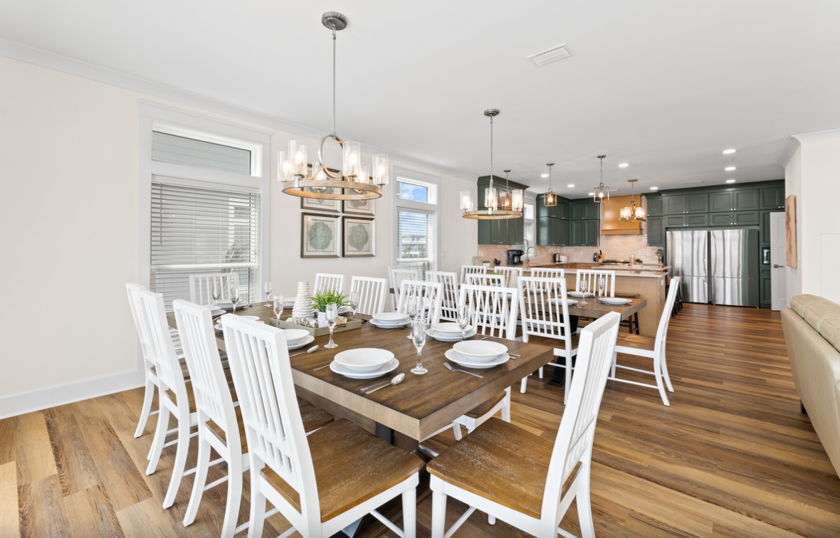 Gather around this beautiful dining table where memorable meals unfold. The open-concept design flows seamlessly into your modern kitchen space.