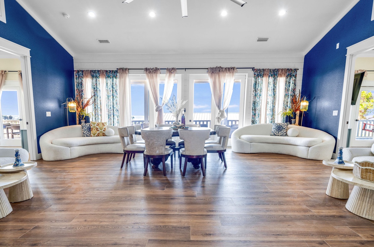 Relax in your stunning waterfront living room with panoramic ocean views and elegant coastal decor.
