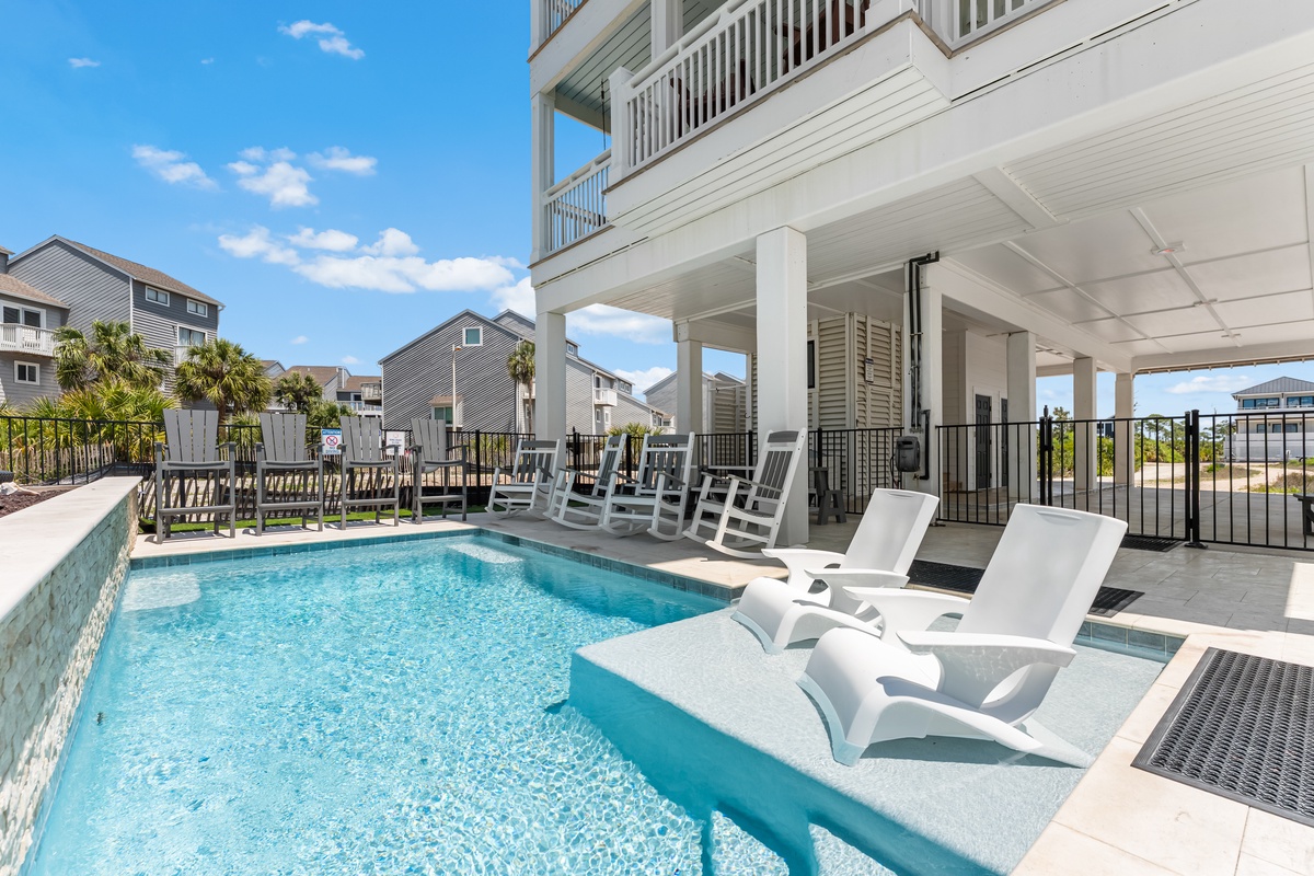 Relax by your private pool with crystal-clear water and comfortable lounge chairs. Your perfect poolside retreat awaits.