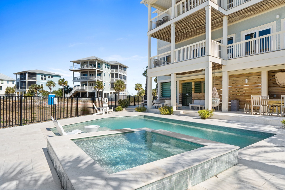 Your private pool and spa create the perfect coastal retreat, where crystal-clear waters invite relaxation under endless blue skies.
