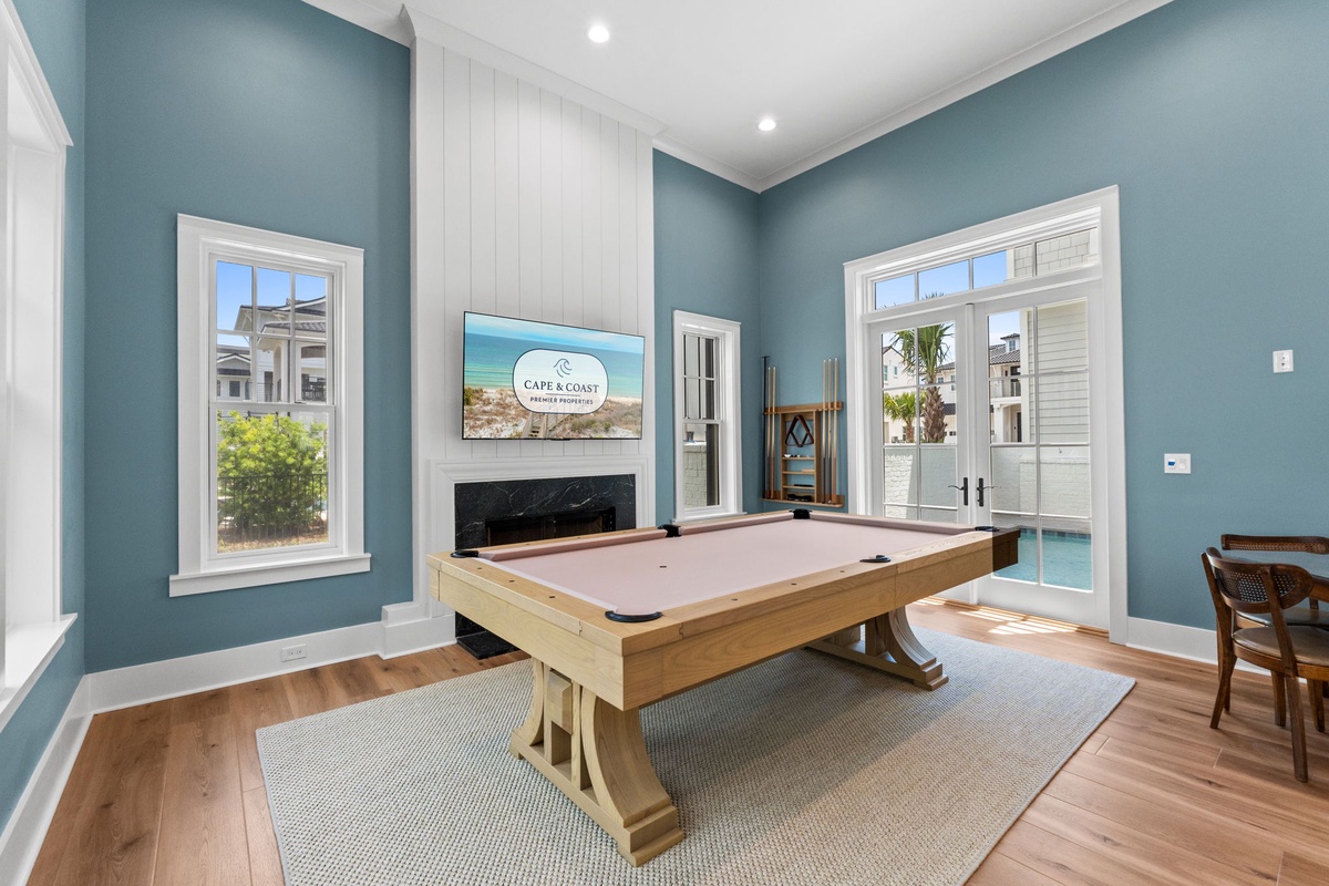 Challenge your friends to a friendly game on this stunning billiards table, set in a bright, coastal-inspired space with easy access to the outdoor areas.
