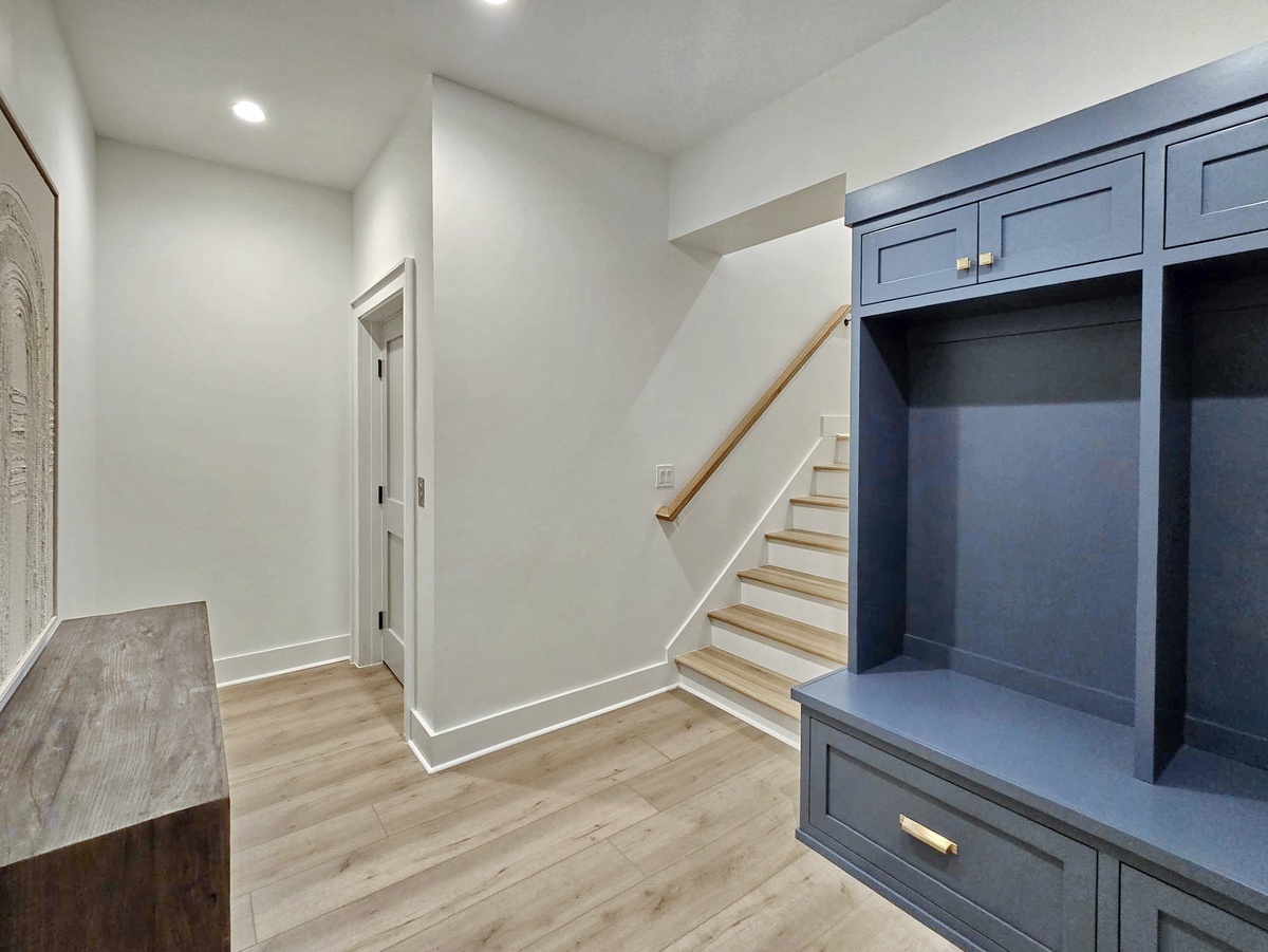 Step into your welcoming entryway with custom mudroom storage, perfect for organizing coats and shoes after exploring.