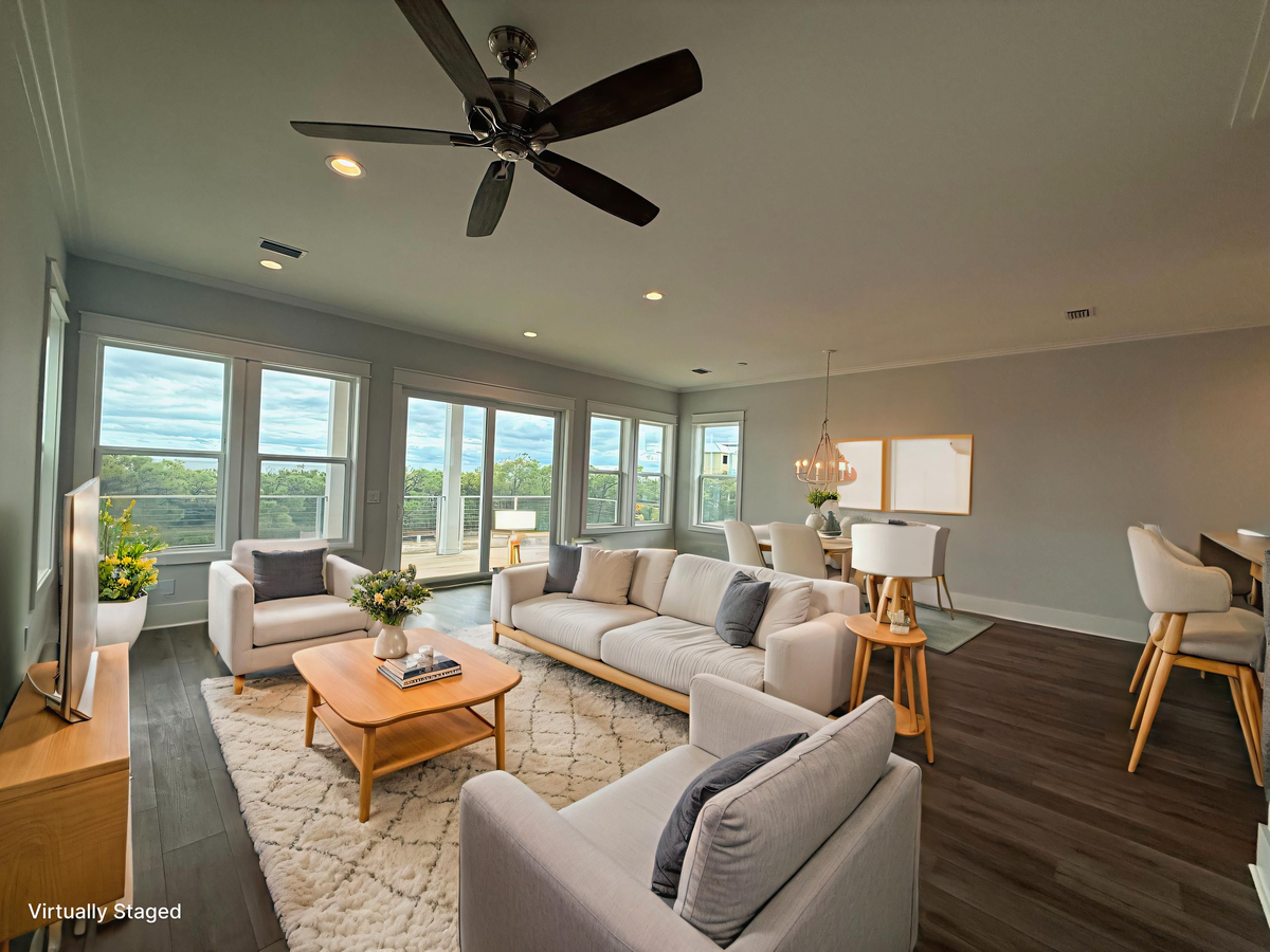 Unwind in your bright, airy living space with stunning panoramic views through floor-to-ceiling windows. The open layout flows seamlessly from cozy seating to dining.