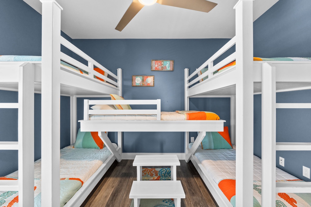 Sleep soundly in this cheerful bunk room where colorful bedding and playful decor create the perfect space for your group's restful nights.