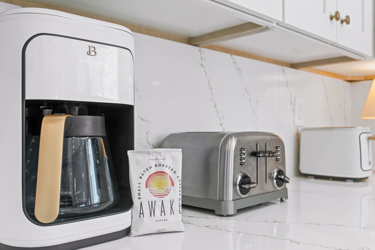 Start your morning right with premium coffee facilities and a sleek toaster ready for your perfect breakfast routine.