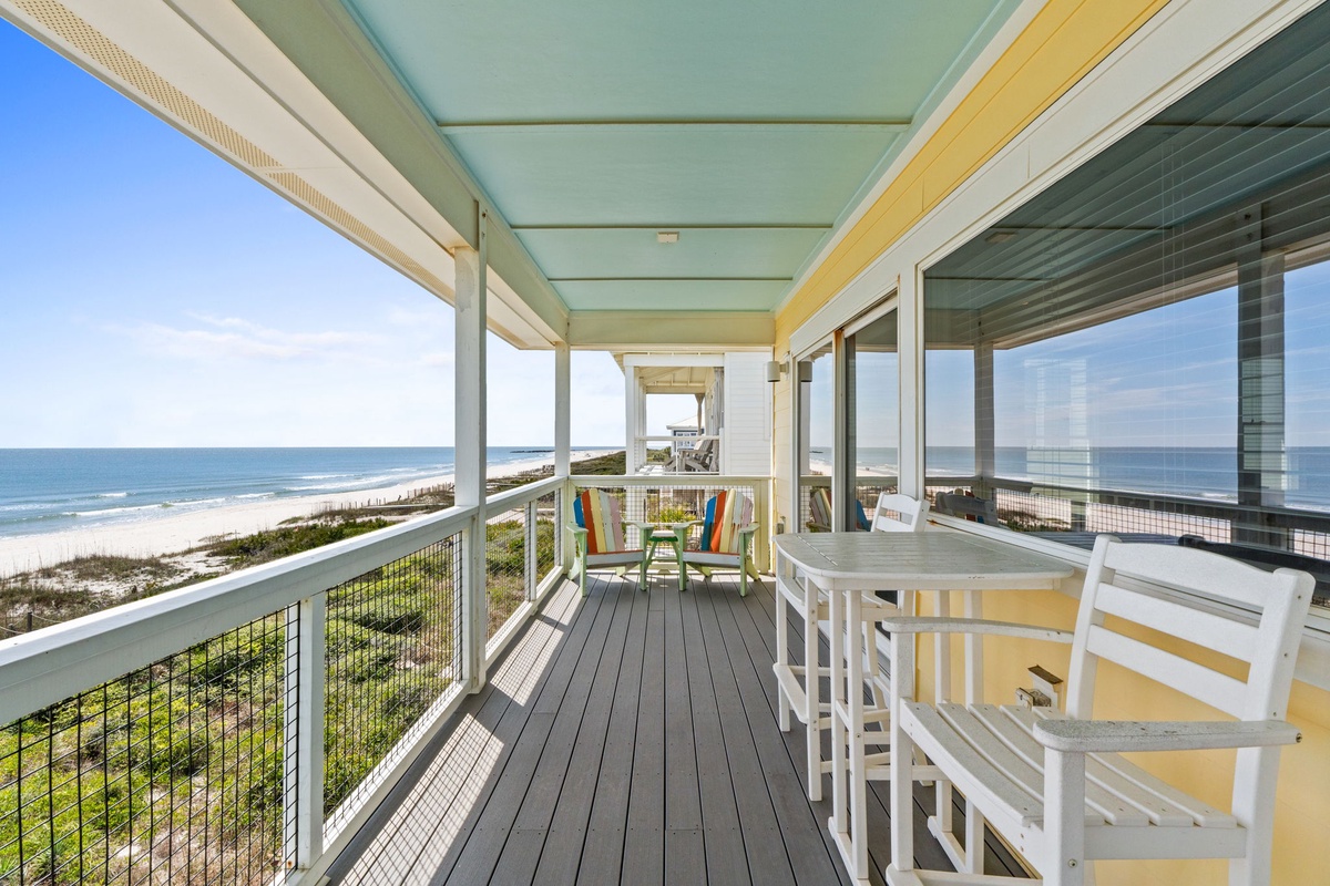 Relax on your private oceanfront terrace with panoramic sea views, perfect for morning coffee or sunset cocktails.