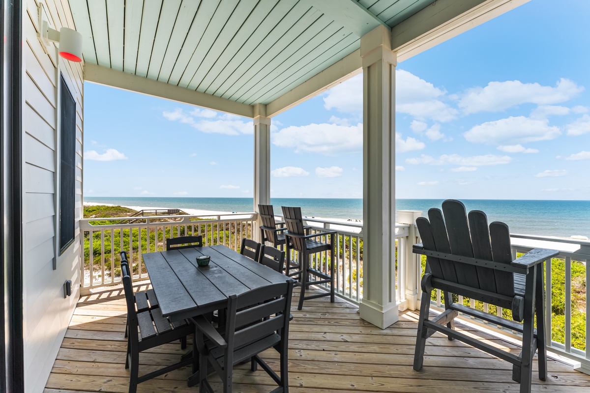 Your private covered deck overlooks pristine beaches, offering the perfect spot to enjoy morning coffee or sunset dinners with ocean breezes.