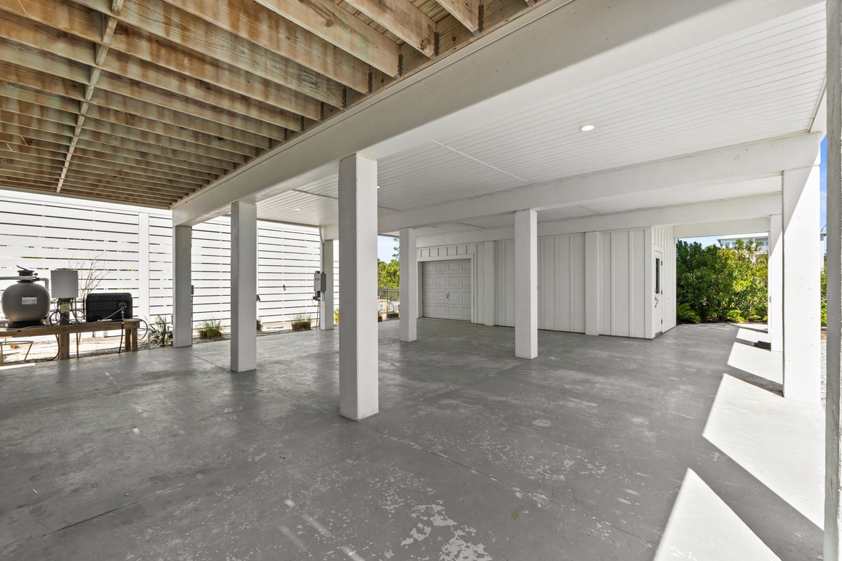 Spacious covered parking and storage area beneath your elevated beach home provides secure vehicle protection and plenty of room for beach gear.