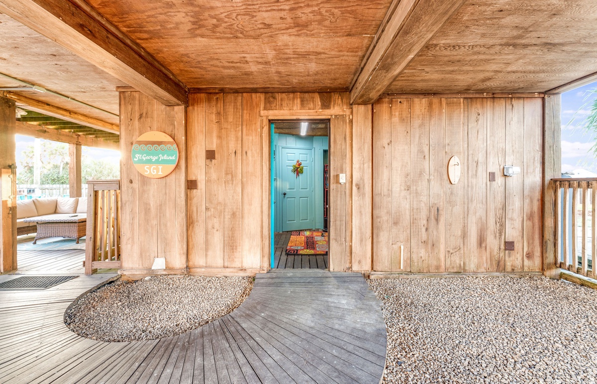 An arcade room, with an extra bathroom, is accessed from the lower level