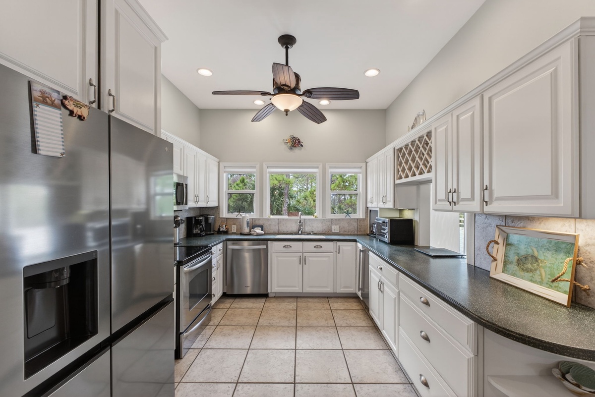 Cook with ease in your fully equipped kitchen featuring granite counters, stainless appliances, and plenty of storage space.