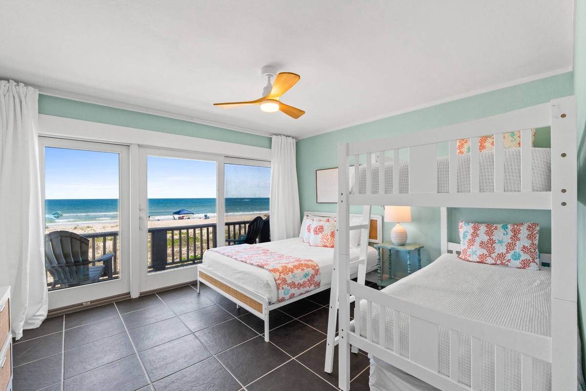 Wake up to stunning ocean views right from your bunk beds. Soft coastal hues and a private balcony invite you to savor morning coffee while watching waves roll in.