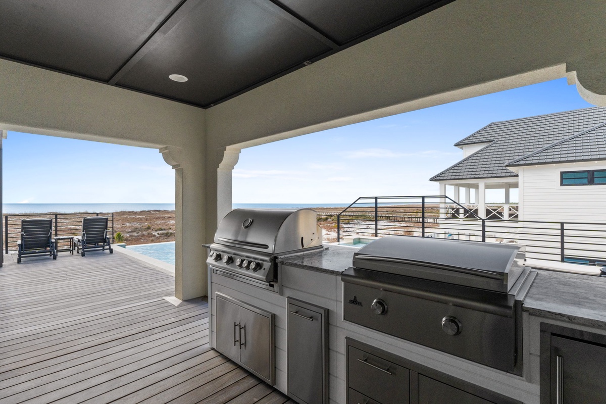 Fire up your culinary adventures on this stunning outdoor deck, where premium grilling stations meet breathtaking coastal views.