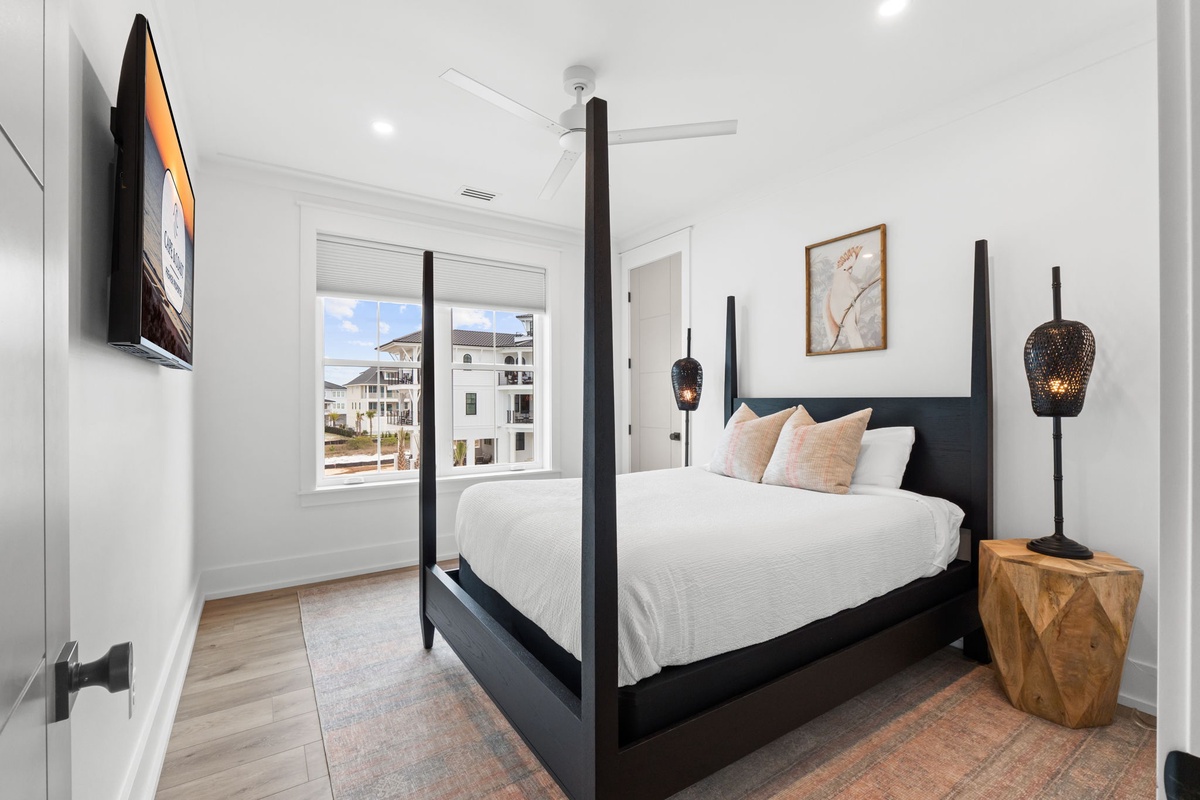 Unwind in your elegant four-poster bed with crisp linens, while coastal views and modern comforts create the perfect retreat.