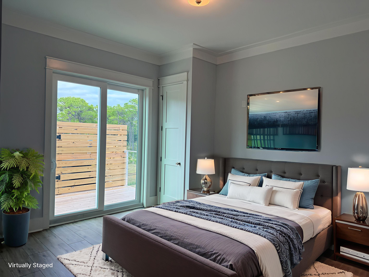 Unwind in your serene bedroom featuring soft linens, natural light, and peaceful views through sliding glass doors to your private patio.