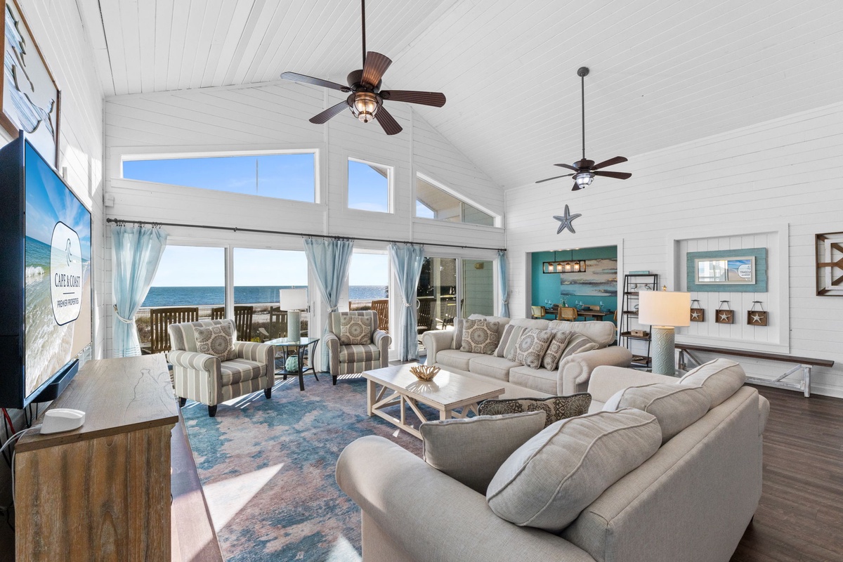 Relax in your coastal living room with stunning ocean views and comfy seating for the whole family.