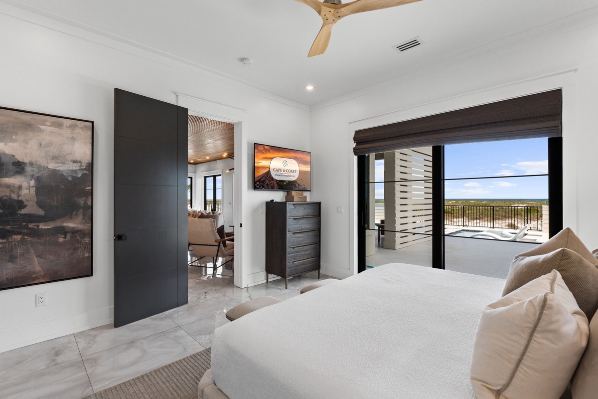 Sink into plush linens in your serene retreat, where modern design meets comfort. Glass doors frame views and lead to your private balcony—perfect for morning coffee or evening relaxation.