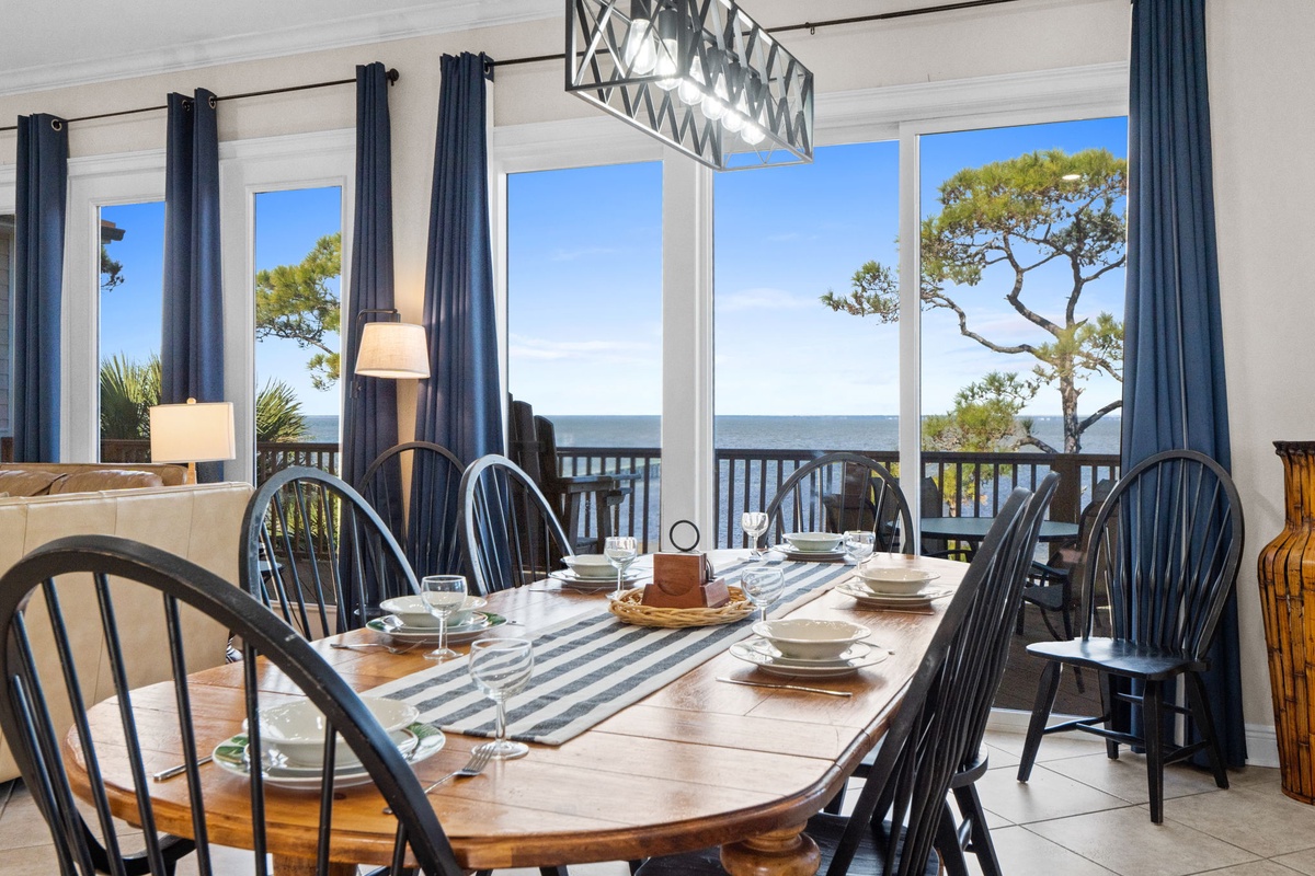 Gather around your stunning seaside dining table where ocean views frame every meal. Natural light floods through windows showcasing breathtaking sea and coastal scenery.