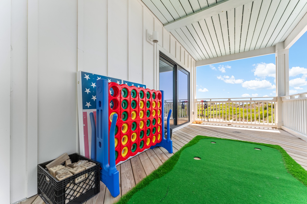 Your private balcony features fun games and artificial putting green, perfect for family entertainment with scenic views.