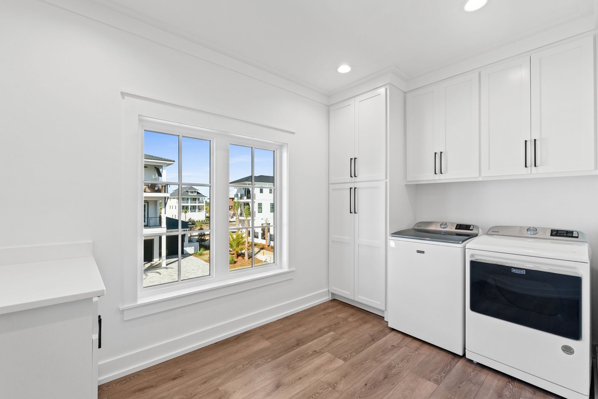 Your laundry day just got easier in this bright, organized space with premium appliances and sunny neighborhood views.