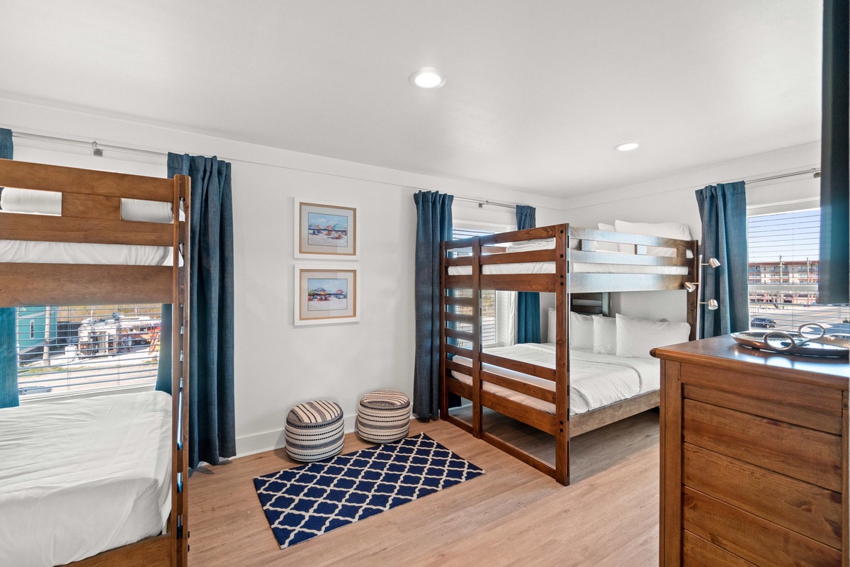 Relax in your spacious bunk room with comfortable beds, cheerful nautical decor, and plenty of space for the whole family to unwind together.
