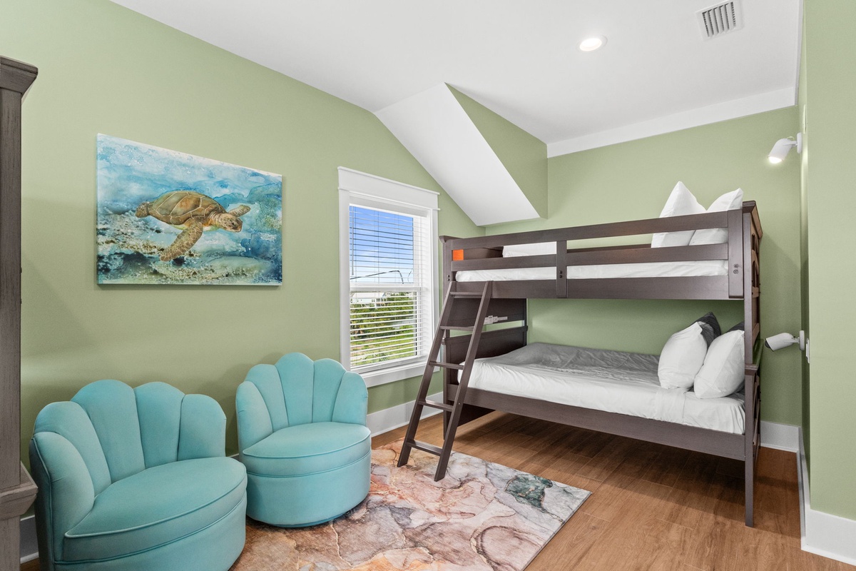 Your kids will love the ocean-themed charm of this bunk room, complete with cozy seating and playful beach décor to make their vacation unforgettable.