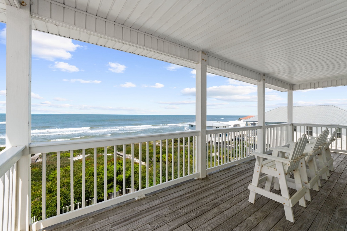 Take in sweeping ocean views from your private covered balcony, where you can relax in comfortable seating and listen to the waves roll in just steps away.