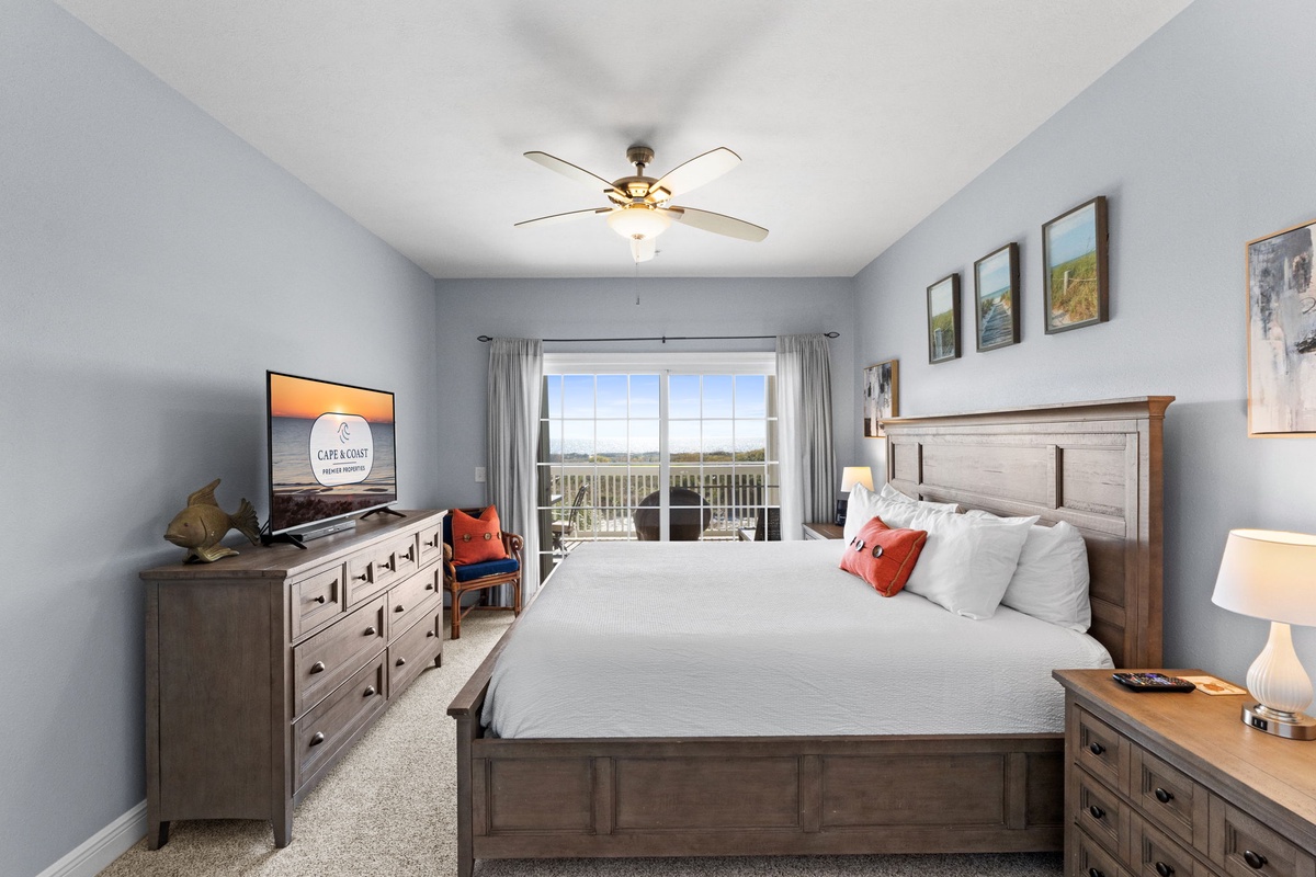 Wake up to peaceful mornings in your comfortable bedroom with natural light streaming through your private balcony doors.