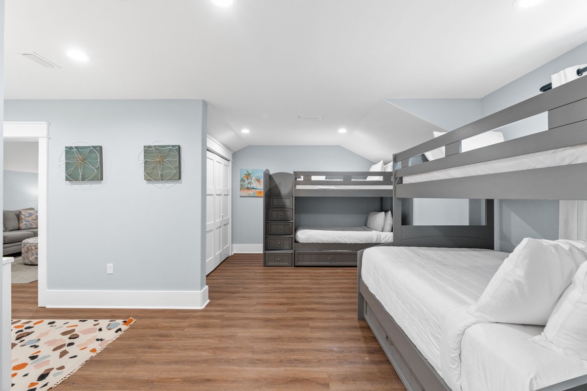 Your peaceful retreat awaits with soft blue walls, warm hardwood floors, and cozy bunk beds—perfect for families or friends traveling together.