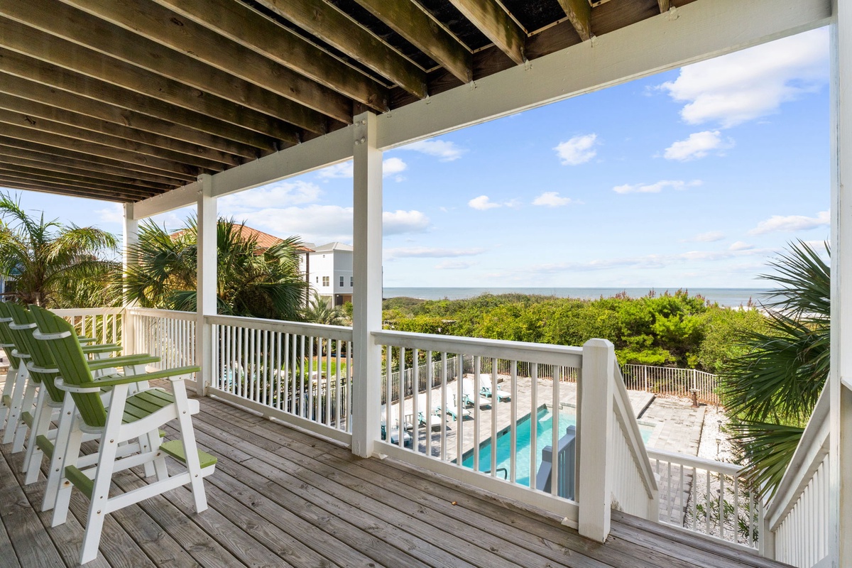 Relax on your private balcony with stunning ocean views stretching to the horizon. Enjoy the tropical breeze, watch the waves, and take in the lush greenery below—your perfect coastal escape awaits.