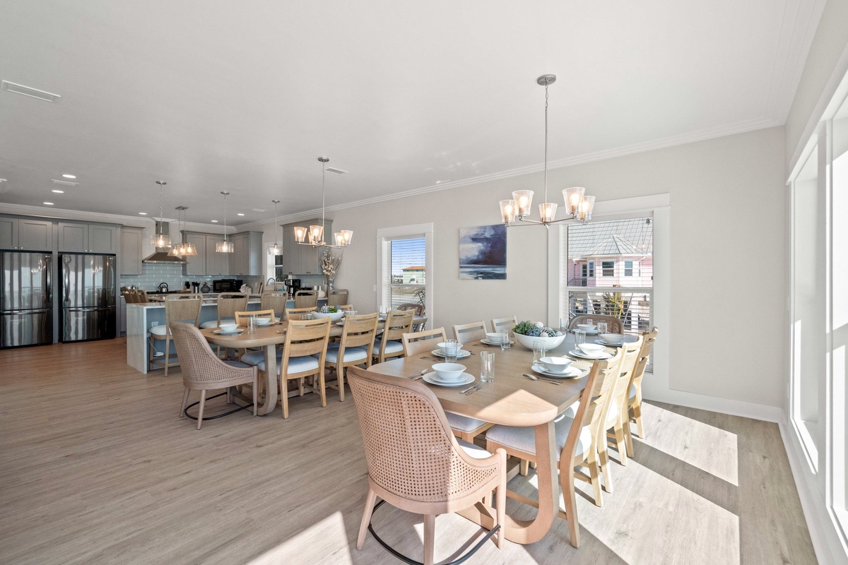 Gather around your spacious dining table for memorable meals, while the fully equipped kitchen awaits your culinary adventures in this beautifully appointed space.