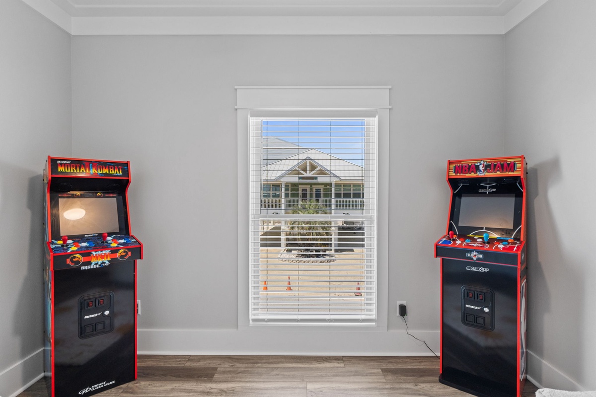 Challenge your friends to classic arcade showdowns in this dedicated game room, complete with iconic Mortal Kombat and NBA Jam machines ready for your next tournament.