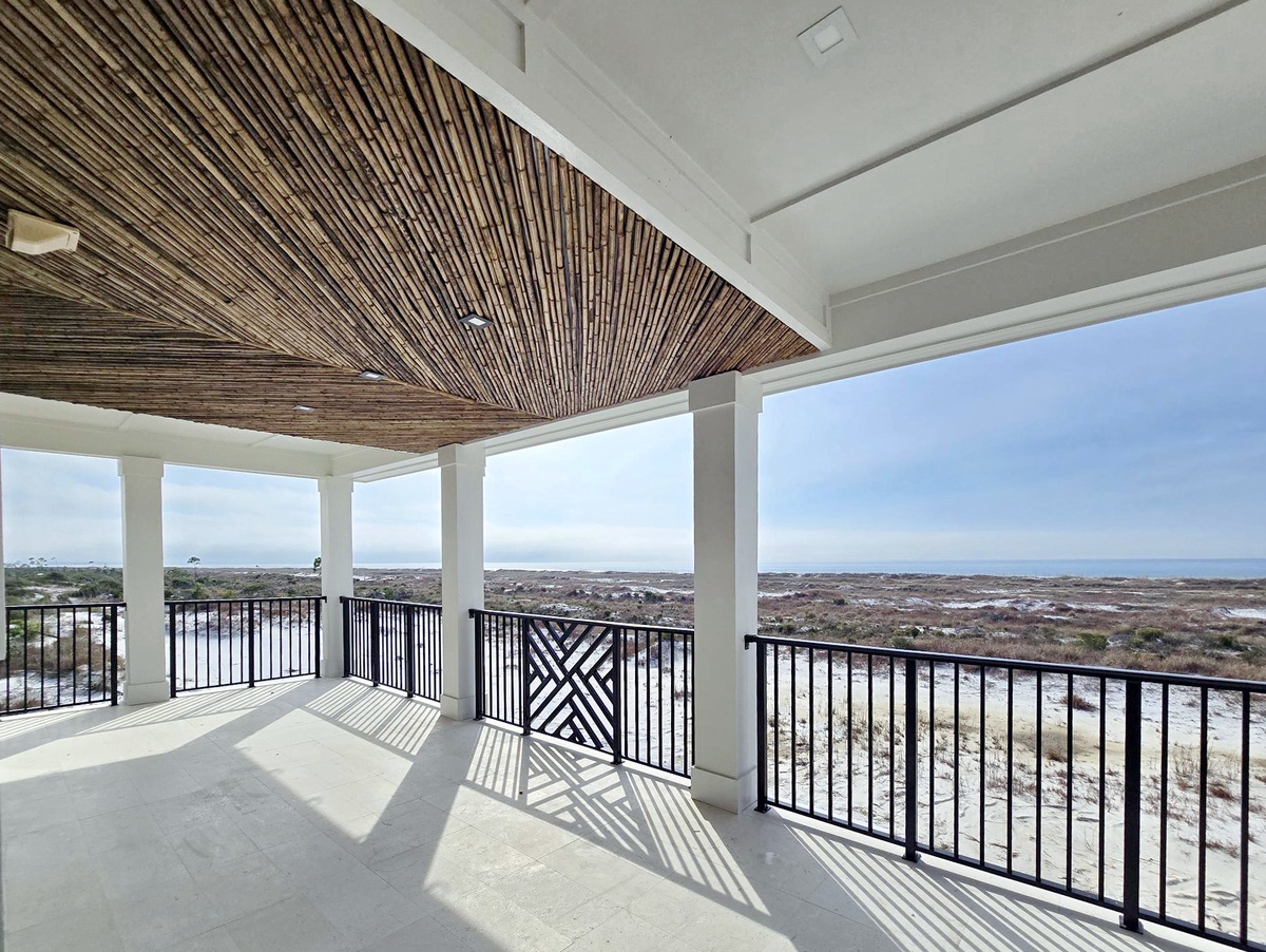 Relax on your private balcony with stunning natural landscape views, featuring bamboo ceiling details and ample shade for peaceful moments.