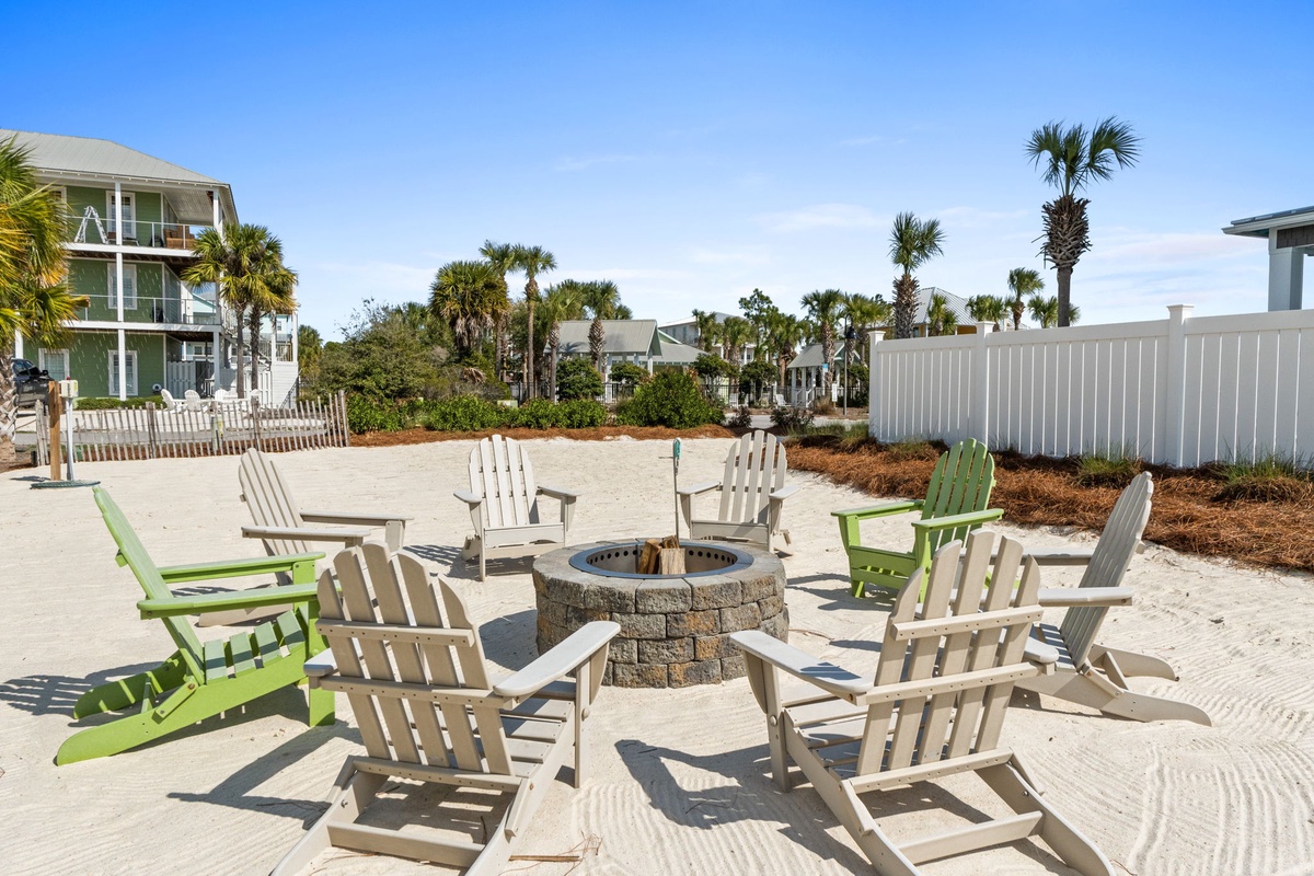Gather around the beachside fire pit where evenings come alive with crackling flames, comfortable Adirondack chairs, and the gentle sound of waves nearby.