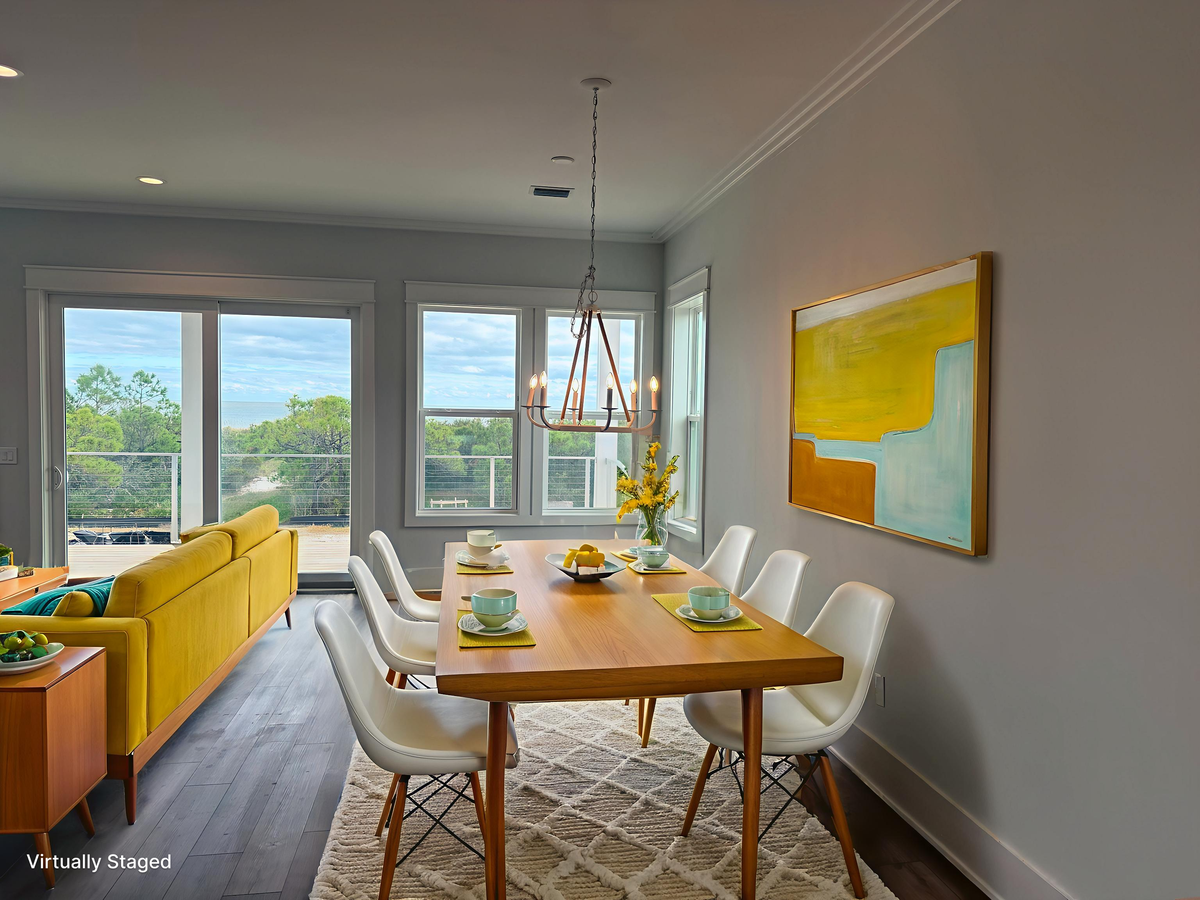 Gather around your stylish dining table with natural light streaming through large windows, creating the perfect setting for memorable meals together.