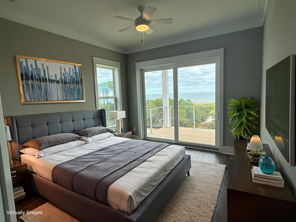 Wake up to stunning ocean views from your comfortable bed, with gentle breezes from the ceiling fan and peaceful moments on your private balcony.