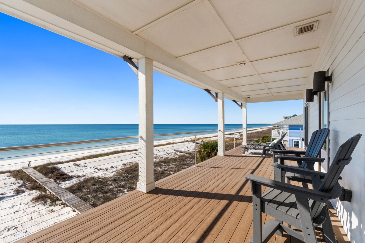 Your private beachfront deck frames endless ocean views, where you'll spend mornings with coffee and evenings watching spectacular sunsets.