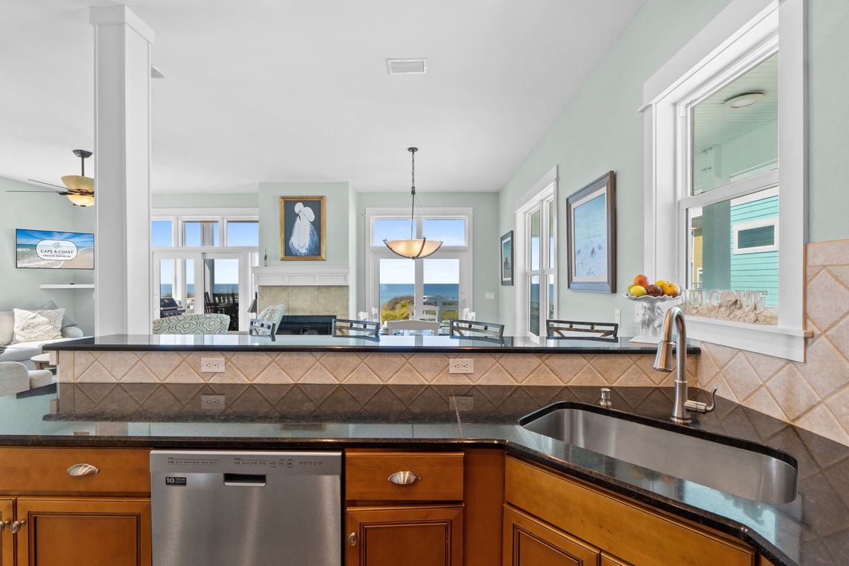 Prepare your favorite meals in this stunning kitchen while enjoying ocean views through every window - perfect for unforgettable vacation cooking.
