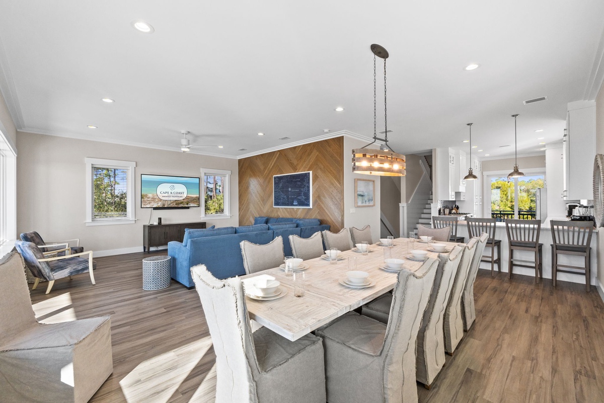 Gather around the spacious dining table for memorable meals with your group in this bright, open-concept living space.
