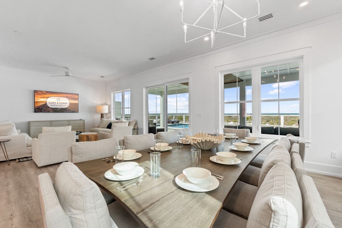 Your elegant dining space features stunning panoramic views through floor-to-ceiling windows, creating the perfect backdrop for memorable meals together.