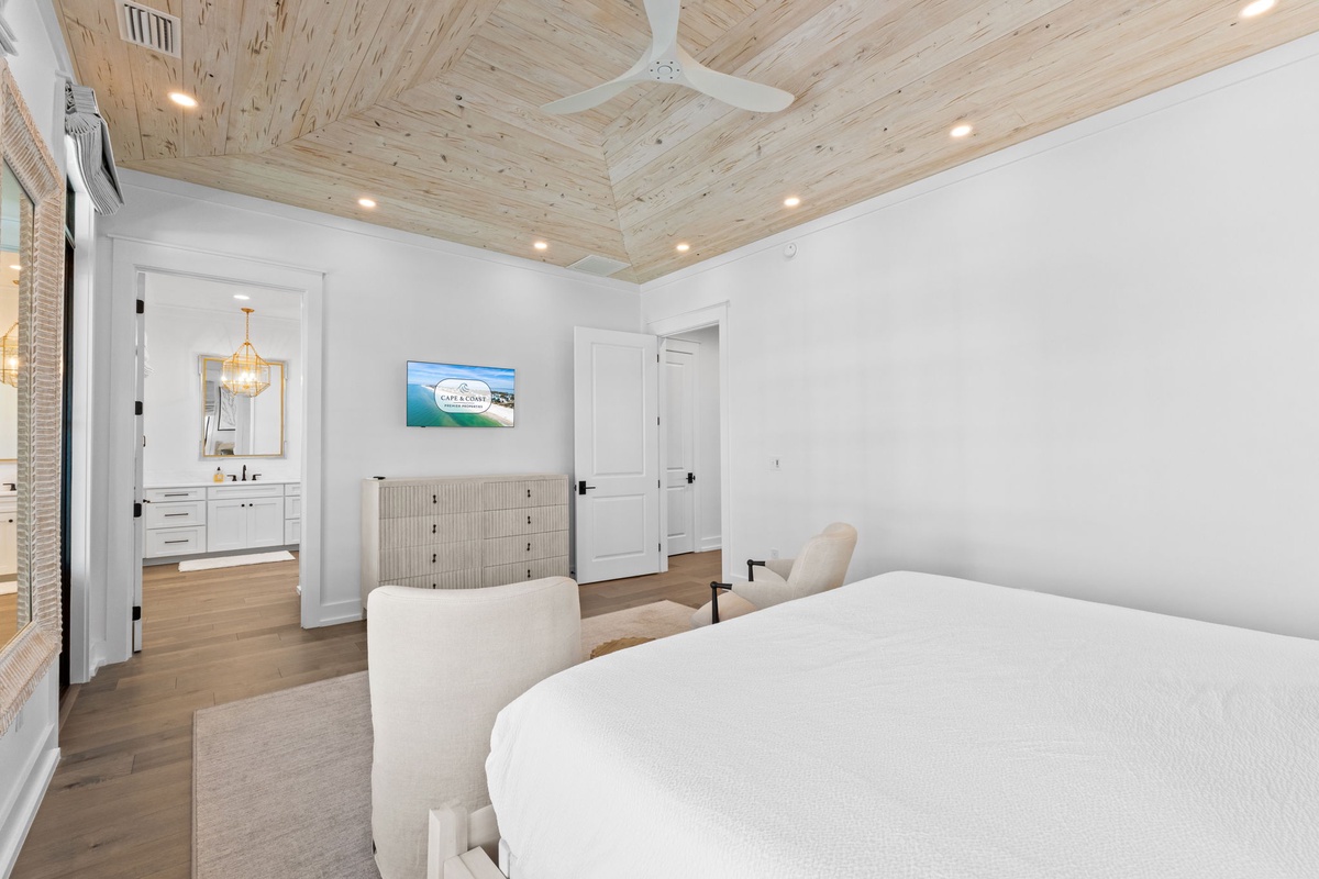 Drift off under the stunning wood-planked ceiling as gentle breezes from your ceiling fan create the perfect sleep sanctuary.