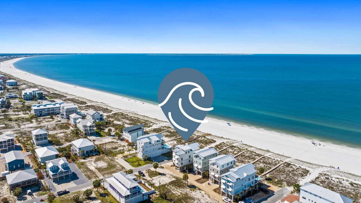 This beachfront community offers direct access to pristine white sand beaches and stunning turquoise waters, with modern coastal homes nestled just steps from the shore.