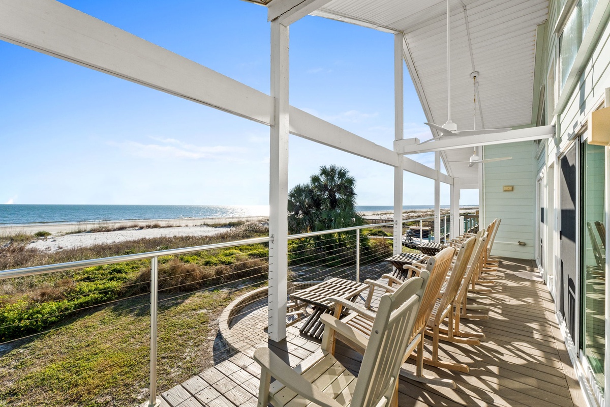Relax in comfortable Adirondack chairs on your private covered deck, where ocean breezes and stunning sea views create the perfect beachfront retreat.