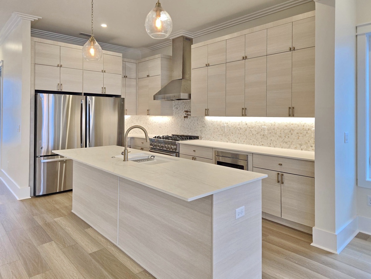 Your spacious kitchen features premium stainless steel appliances, quartz countertops, and a large island perfect for cooking memorable meals together.
