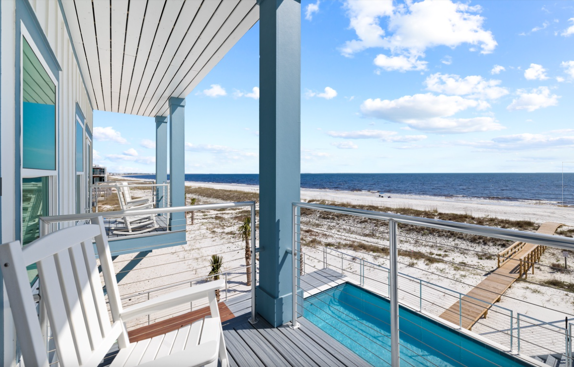 Step onto your private deck and breathe in the salty ocean breeze while enjoying panoramic sea views from this stunning beachfront retreat.